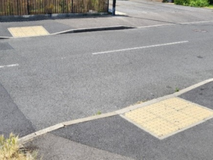 Dropped kerb with tactile paving at an informal crossing point